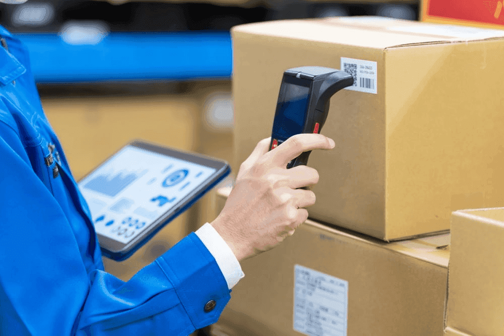 Worker Scanning Barcode of a Package